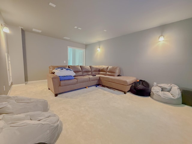 living room featuring light colored carpet and baseboards