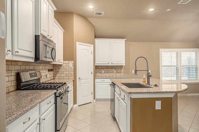 kitchen with light tile patterned floors, visible vents, appliances with stainless steel finishes, and a sink