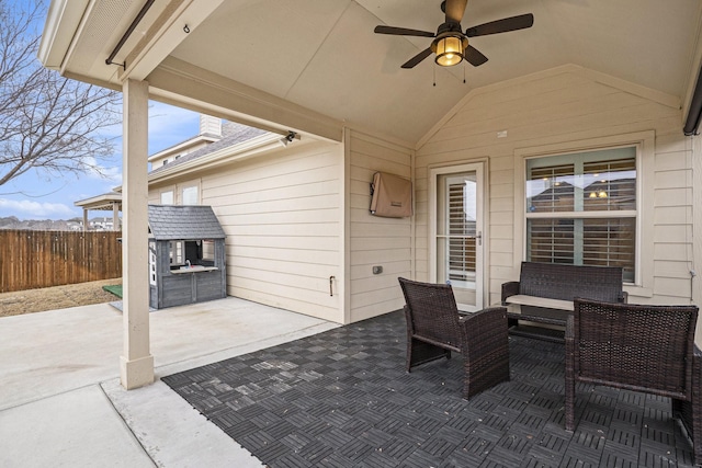 view of patio featuring a ceiling fan and fence