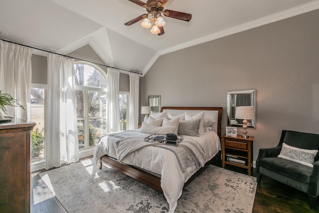 bedroom featuring lofted ceiling, crown molding, ceiling fan, and wood finished floors