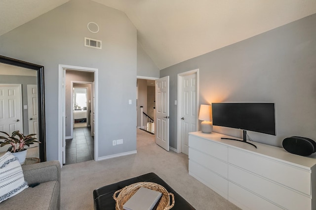 bedroom with high vaulted ceiling, baseboards, visible vents, and light colored carpet