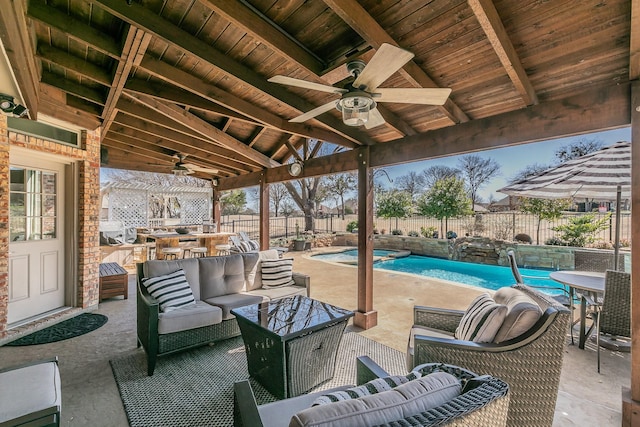 view of patio featuring a ceiling fan, a fenced in pool, a fenced backyard, and an outdoor hangout area