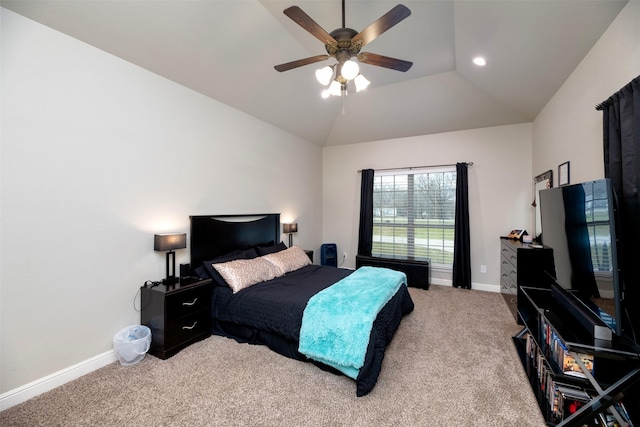 carpeted bedroom with lofted ceiling, ceiling fan, and baseboards