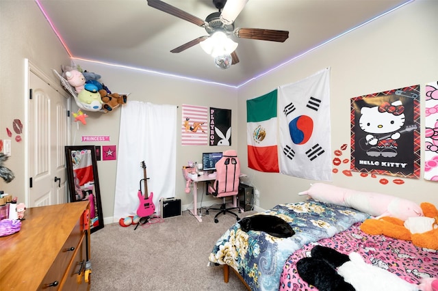 bedroom featuring carpet floors, baseboards, and a ceiling fan