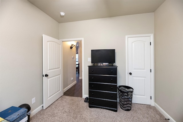 bedroom featuring carpet flooring and baseboards