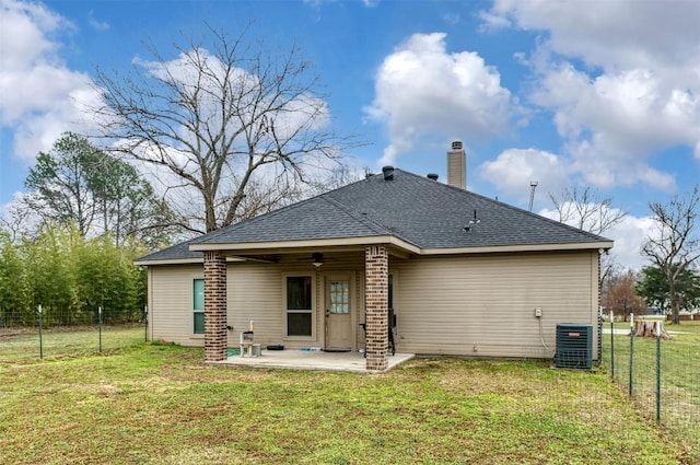 back of house with a yard, a patio, a fenced backyard, and a ceiling fan