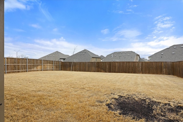 view of yard featuring a fenced backyard