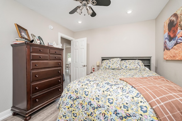 bedroom with recessed lighting, light wood-type flooring, a ceiling fan, and baseboards