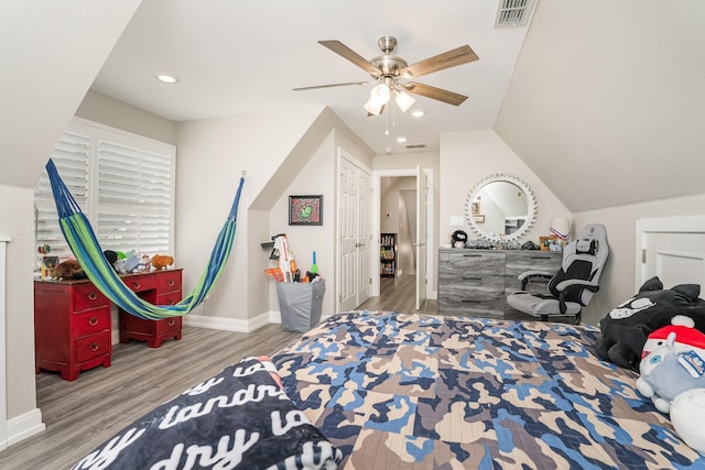 bedroom with recessed lighting, wood finished floors, visible vents, and baseboards