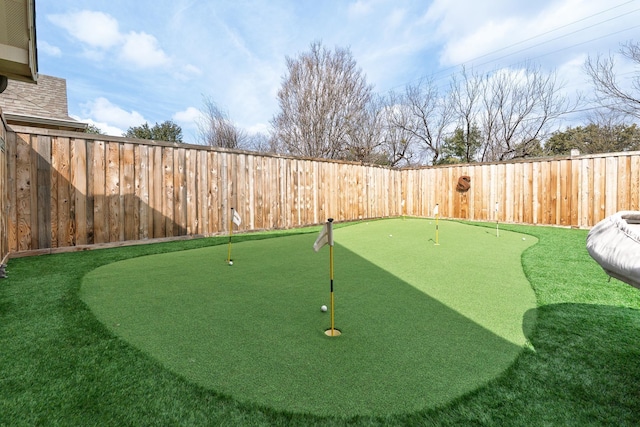 view of community with a fenced backyard