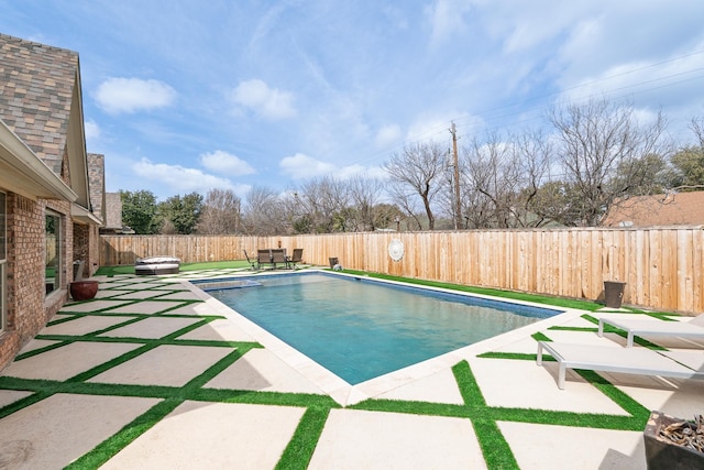 view of swimming pool with a patio area, a fenced backyard, and a fenced in pool