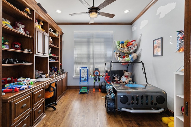 home office featuring ceiling fan, ornamental molding, wood finished floors, and baseboards