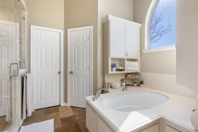 full bathroom featuring a shower stall