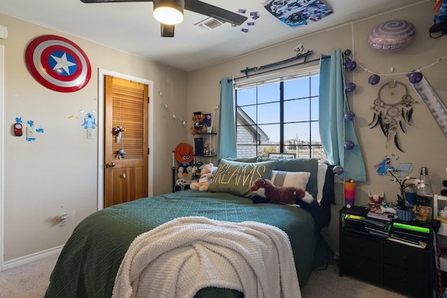 bedroom with carpet floors, visible vents, baseboards, and a ceiling fan