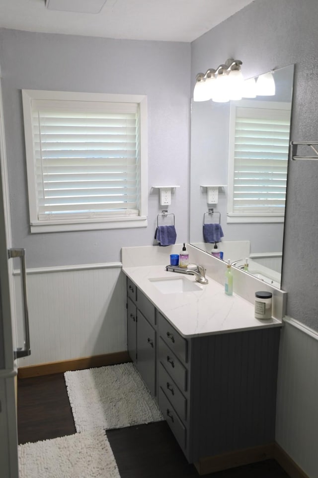 bathroom featuring wainscoting and vanity