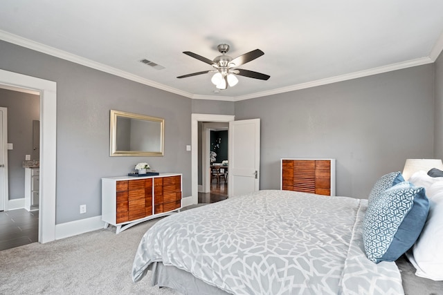 carpeted bedroom featuring baseboards, visible vents, ornamental molding, and ceiling fan