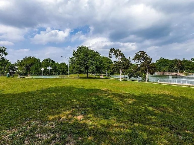 view of home's community with a yard