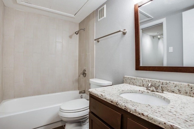 bathroom with visible vents, a textured wall, toilet, washtub / shower combination, and vanity