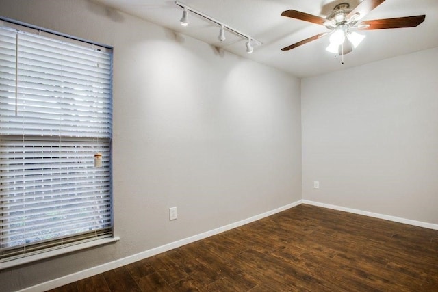 unfurnished room featuring baseboards, a ceiling fan, and wood finished floors