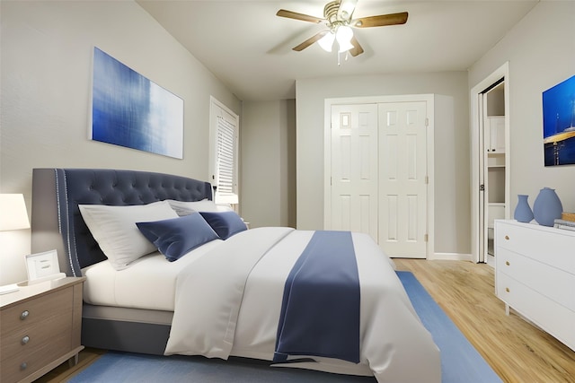 bedroom with light wood-style flooring, baseboards, and ceiling fan