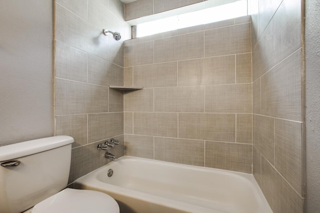 bathroom with shower / tub combination and toilet