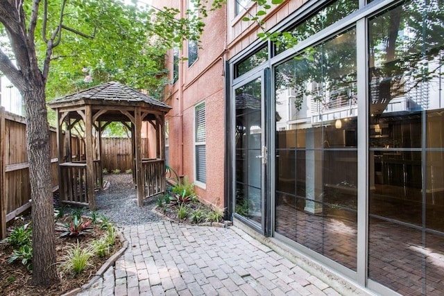 view of patio / terrace with a gazebo and fence