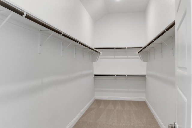 5509 Gaelic Dr, Celina, TX 75009 - walk in closet featuring light colored carpet and vaulted ceiling