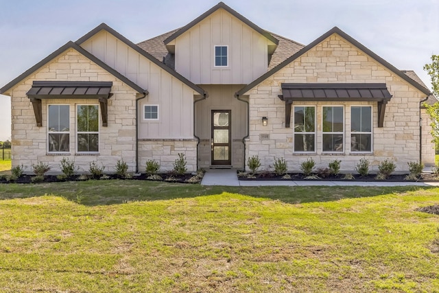 5509 Gaelic Dr, Celina, TX 75009 - modern farmhouse featuring board and batten siding, a shingled roof, stone siding, and a front lawn