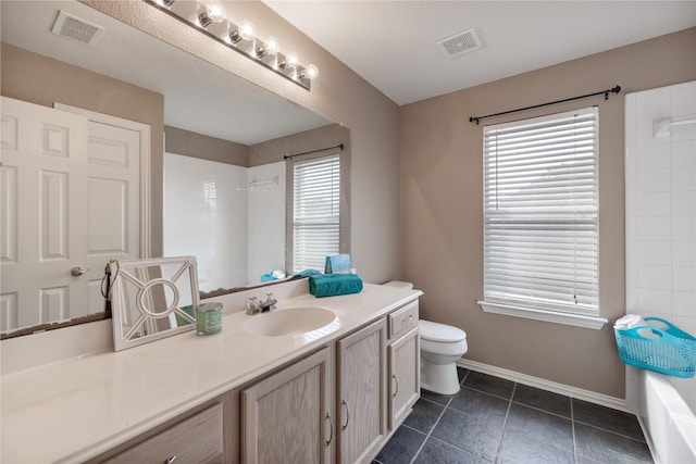 full bathroom featuring toilet, vanity, visible vents, and baseboards