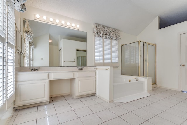 full bathroom with tile patterned flooring, double vanity, and a bath