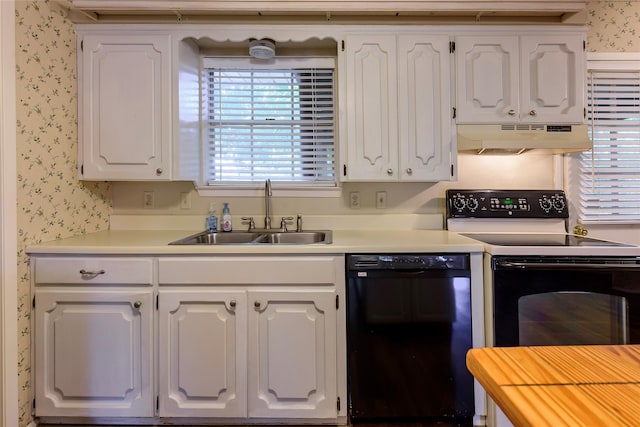 kitchen featuring white cabinetry, a sink, under cabinet range hood, black appliances, and wallpapered walls