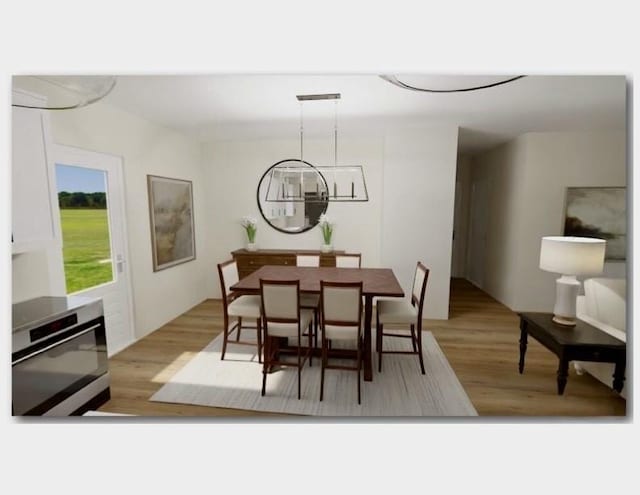 dining room with visible vents and wood finished floors