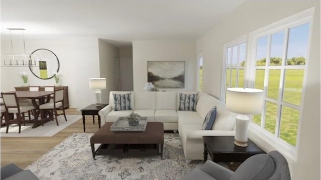 living room featuring an inviting chandelier and wood finished floors