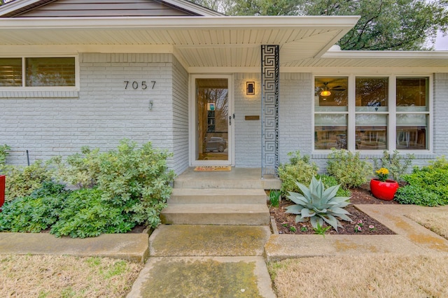 property entrance with brick siding