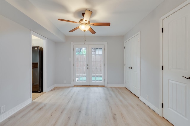 doorway to outside featuring french doors, light wood-type flooring, a ceiling fan, and baseboards