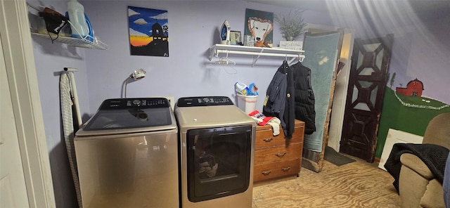 laundry area featuring laundry area and washer and clothes dryer