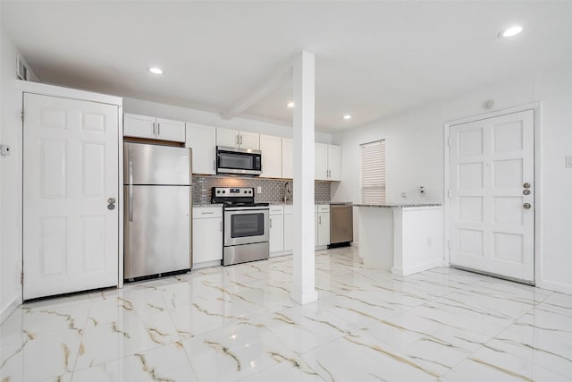 kitchen featuring recessed lighting, stainless steel appliances, white cabinetry, marble finish floor, and decorative backsplash