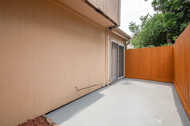 view of patio / terrace featuring fence