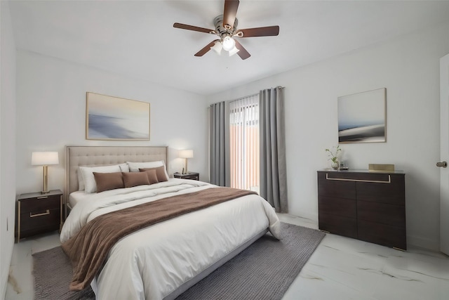 bedroom featuring marble finish floor and ceiling fan