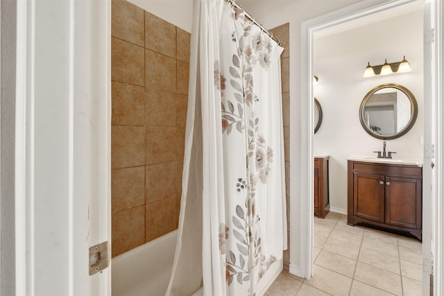 bathroom featuring tile patterned floors, vanity, and shower / tub combo