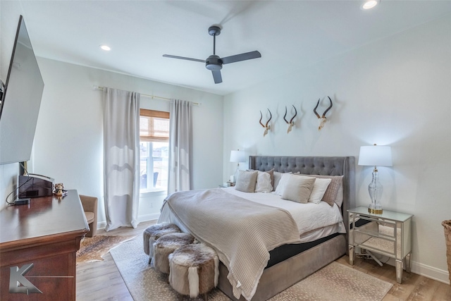 bedroom with ceiling fan, light wood finished floors, recessed lighting, and baseboards