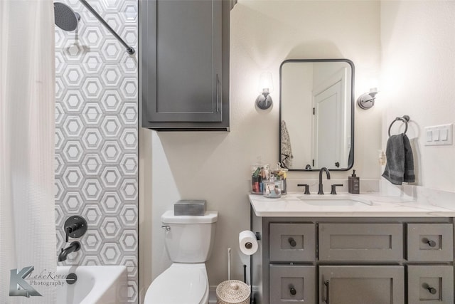 bathroom with vanity, toilet, and shower / bath combo with shower curtain