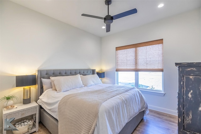 bedroom featuring ceiling fan, recessed lighting, wood finished floors, and baseboards