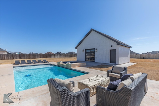 view of pool with a patio area, a fenced backyard, an exterior structure, and an outdoor structure