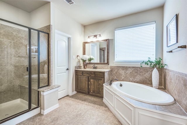 full bath featuring a garden tub, visible vents, a stall shower, vanity, and tile patterned floors