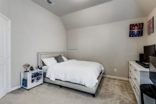 bedroom featuring light colored carpet, vaulted ceiling, visible vents, and baseboards