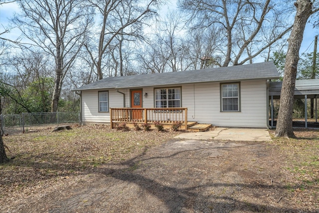 view of front of home with fence and a deck