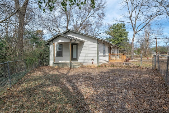 bungalow-style home with fence private yard and a porch