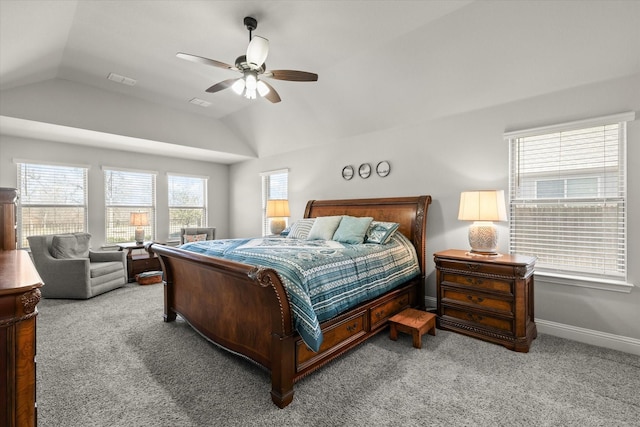 carpeted bedroom with lofted ceiling, visible vents, baseboards, and a ceiling fan