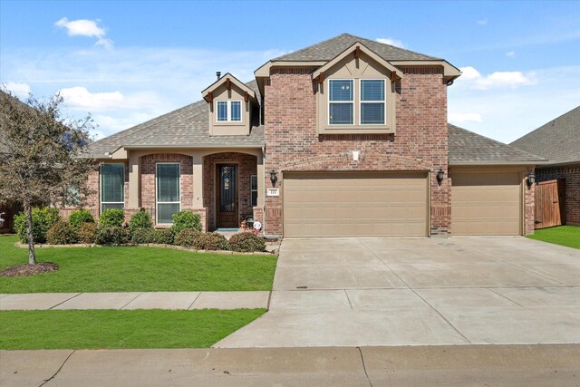 222 Oakcrest Dr, Justin, TX 76247 - view of front of property featuring brick siding, roof with shingles, a front yard, driveway, and a garage